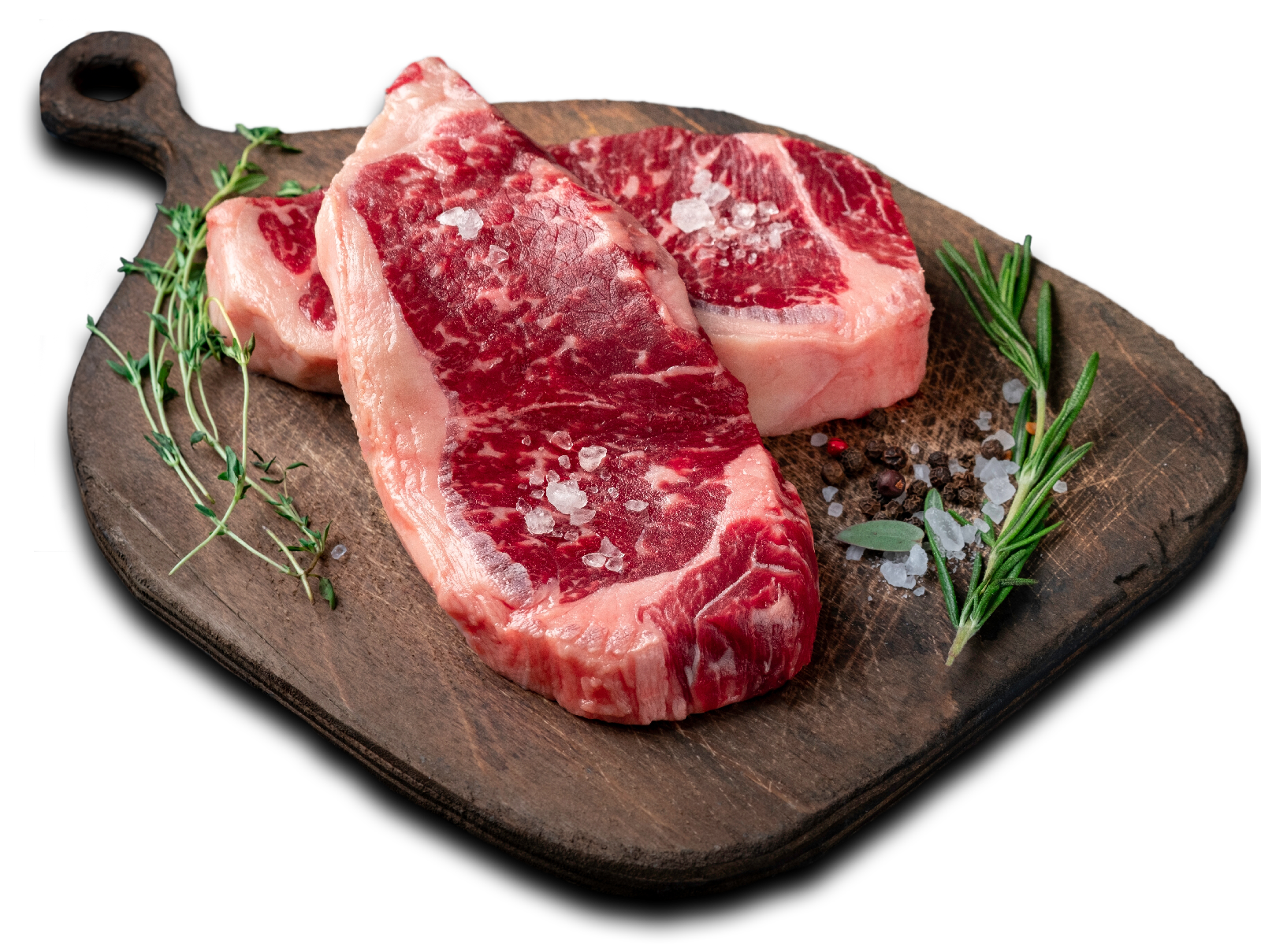 ribeye steaks on a cutting board